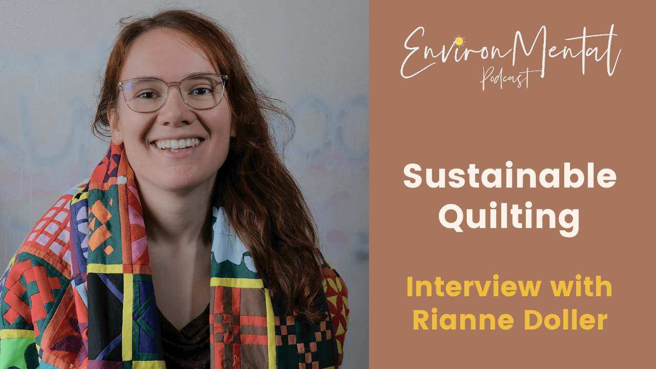 A Photo of Rianne Doller smiling and wearing a quilt with words that say, EnvironMental Podcast, sustainable quilting, interview with Rianne Doller